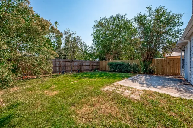 a view of backyard with green space
