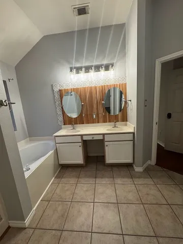 a bathroom with a sink a toilet and tub