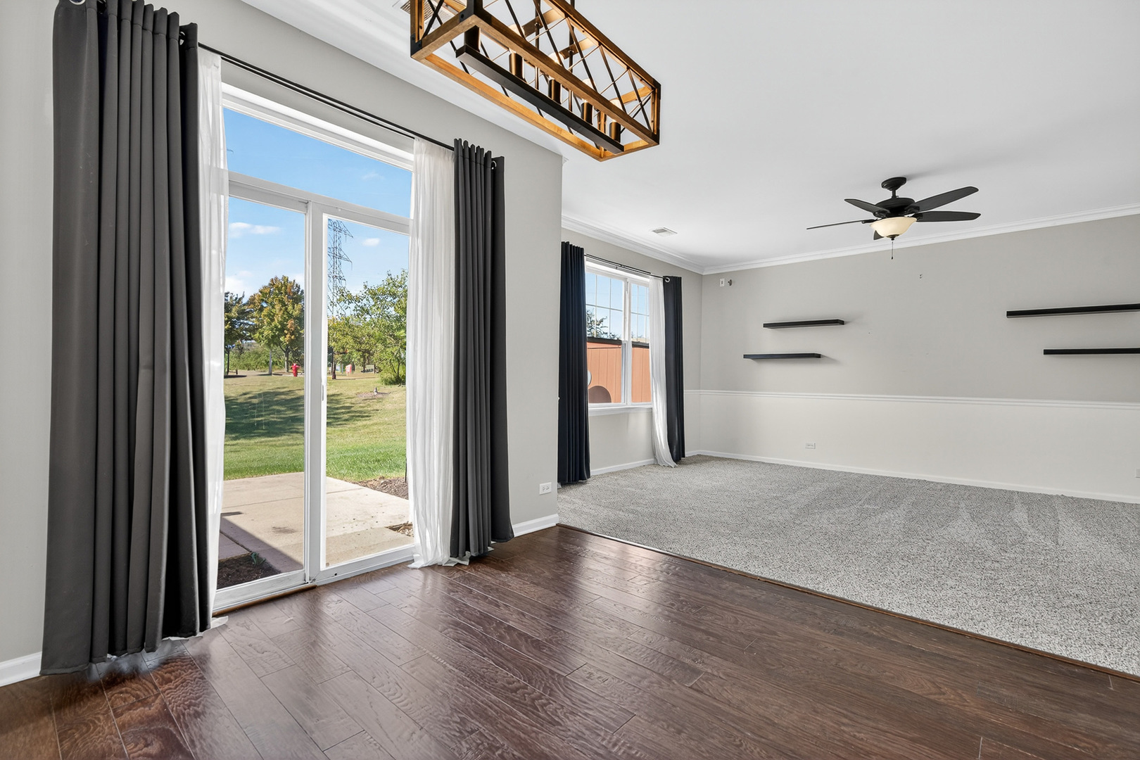 2870 Glacier Way, Unit B Wauconda, IL 60084 - Photo 11 of 35 a view of a hallway with wooden floor and a ceiling fan