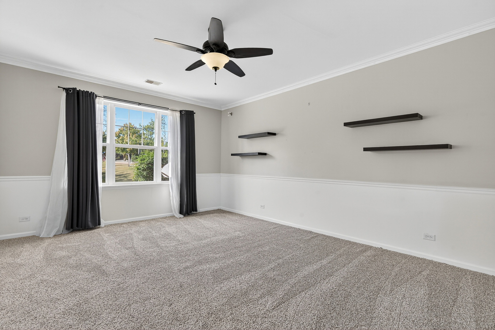 2870 Glacier Way, Unit B Wauconda, IL 60084 - Photo 13 of 35 a view of a livingroom with a ceiling fan and window