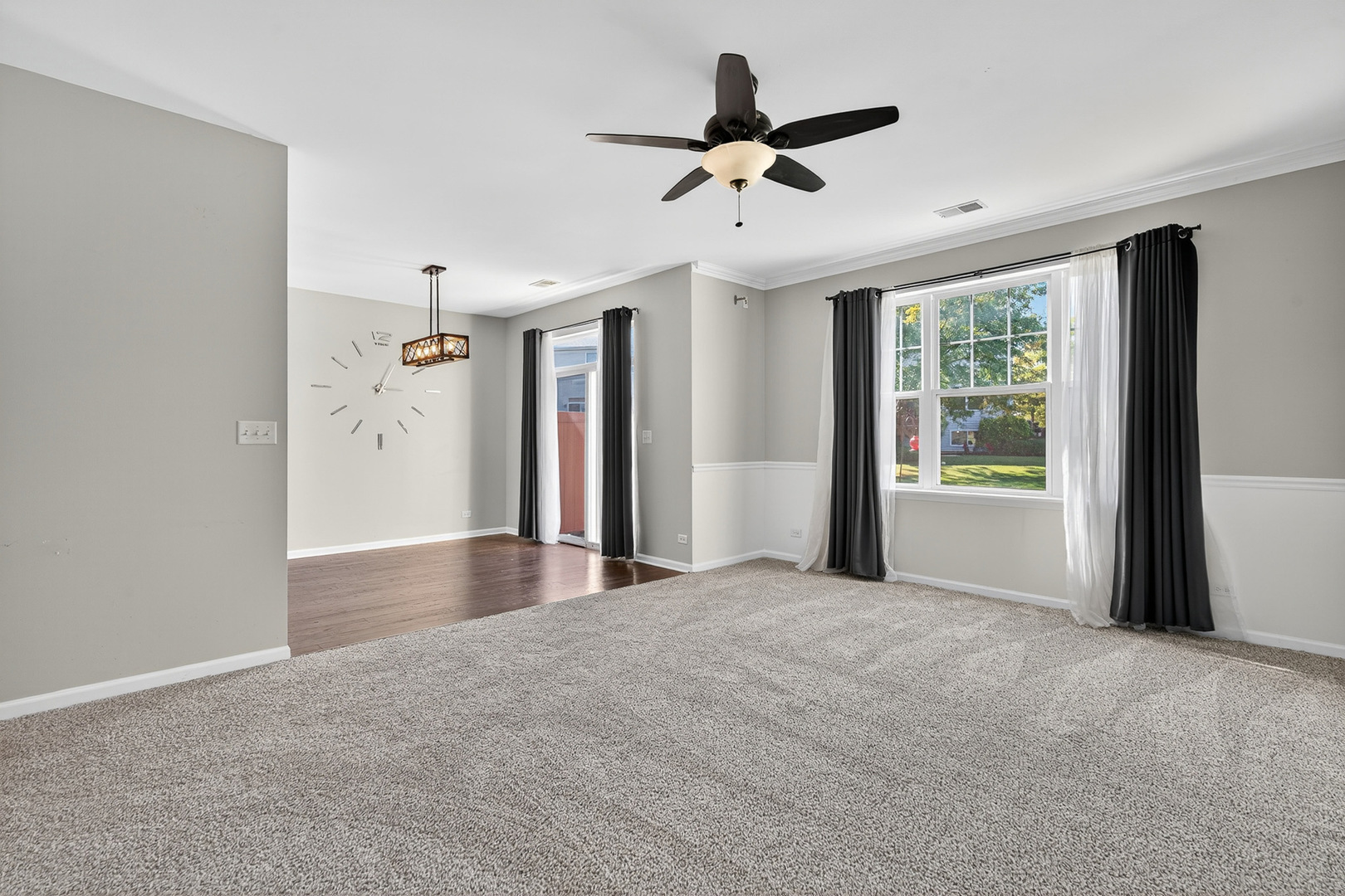 2870 Glacier Way, Unit B Wauconda, IL 60084 - Photo 14 of 35 a view of a livingroom with a ceiling fan and window