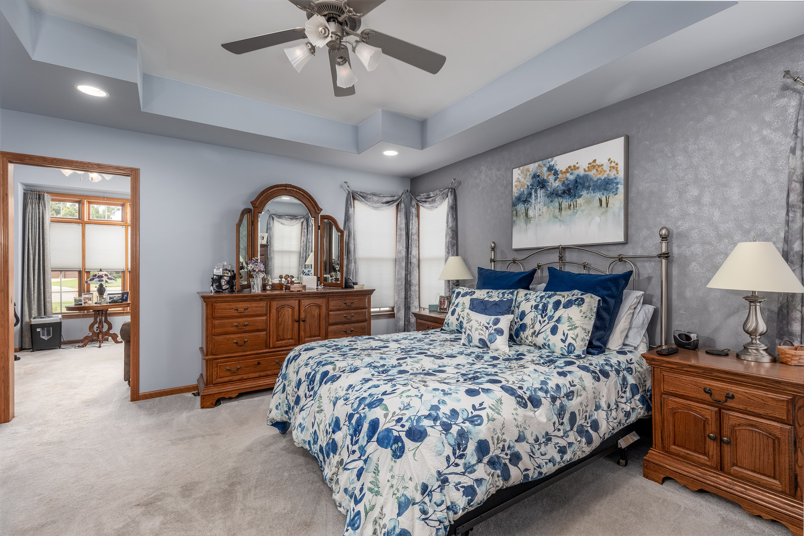 3622 East 1769th Road Ottawa, IL 61350 - Photo 16 of 42 a bedroom with a large bed and a chandelier