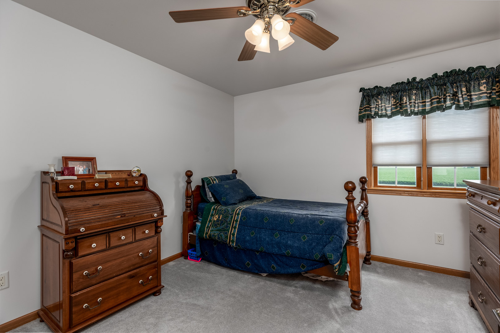3622 East 1769th Road Ottawa, IL 61350 - Photo 22 of 42 a bedroom with a bed and a chandelier