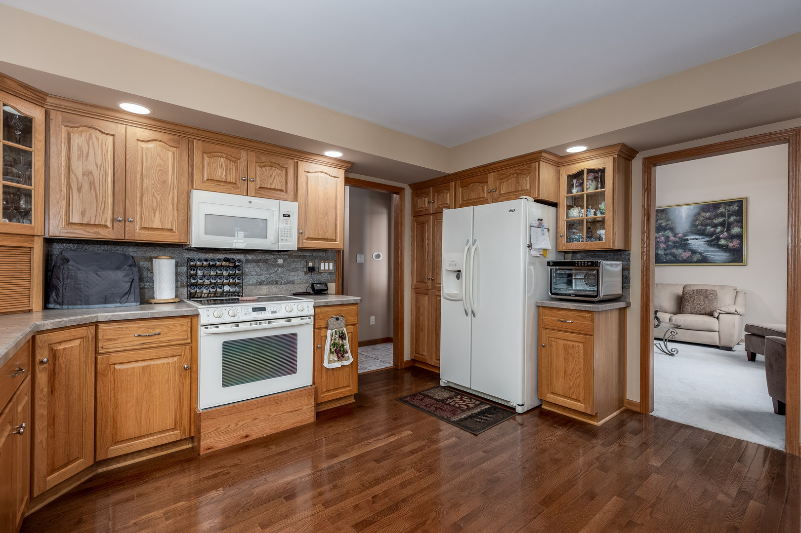 3622 East 1769th Road Ottawa, IL 61350 - Photo 9 of 42 a kitchen with granite countertop a refrigerator stove and sink