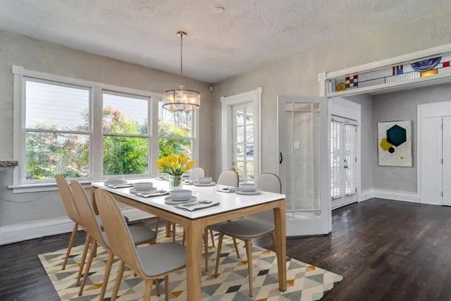a dining room with furniture window wooden floor