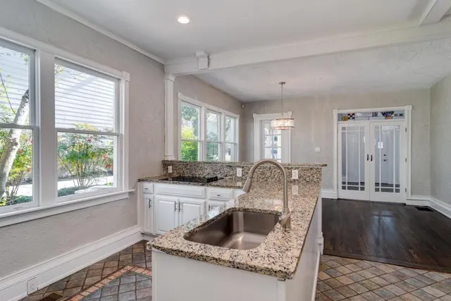 a kitchen with a sink and a refrigerator