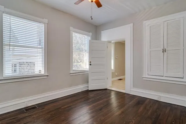 a bathroom with a sink toilet and a mirror