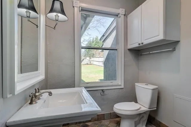 a bathroom with a sink and mirror