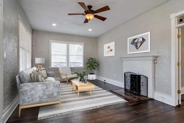 a living room with furniture and a fireplace