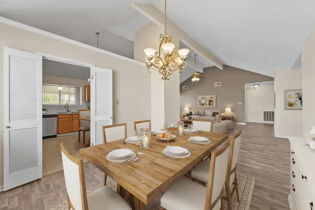 a view of a dining room with furniture and wooden floor
