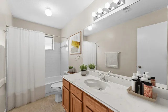 a bathroom with a sink double vanity and a mirror