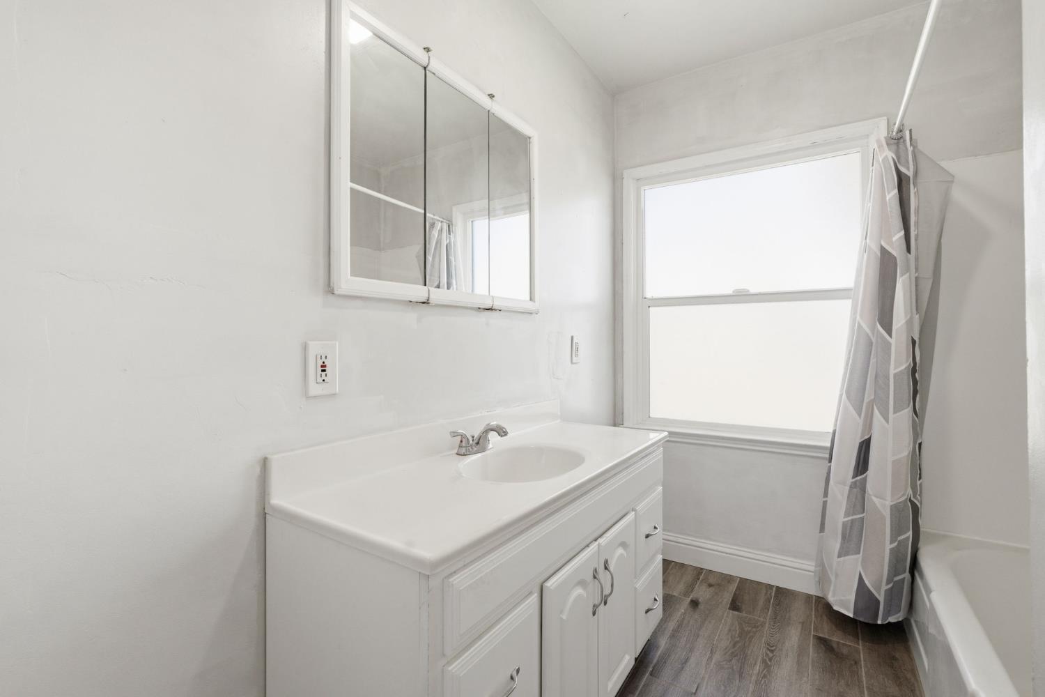 133 Oleander Avenue Lemoore, CA 93245 - Photo 17 of 30 a view of a sink and a window in a laundry room