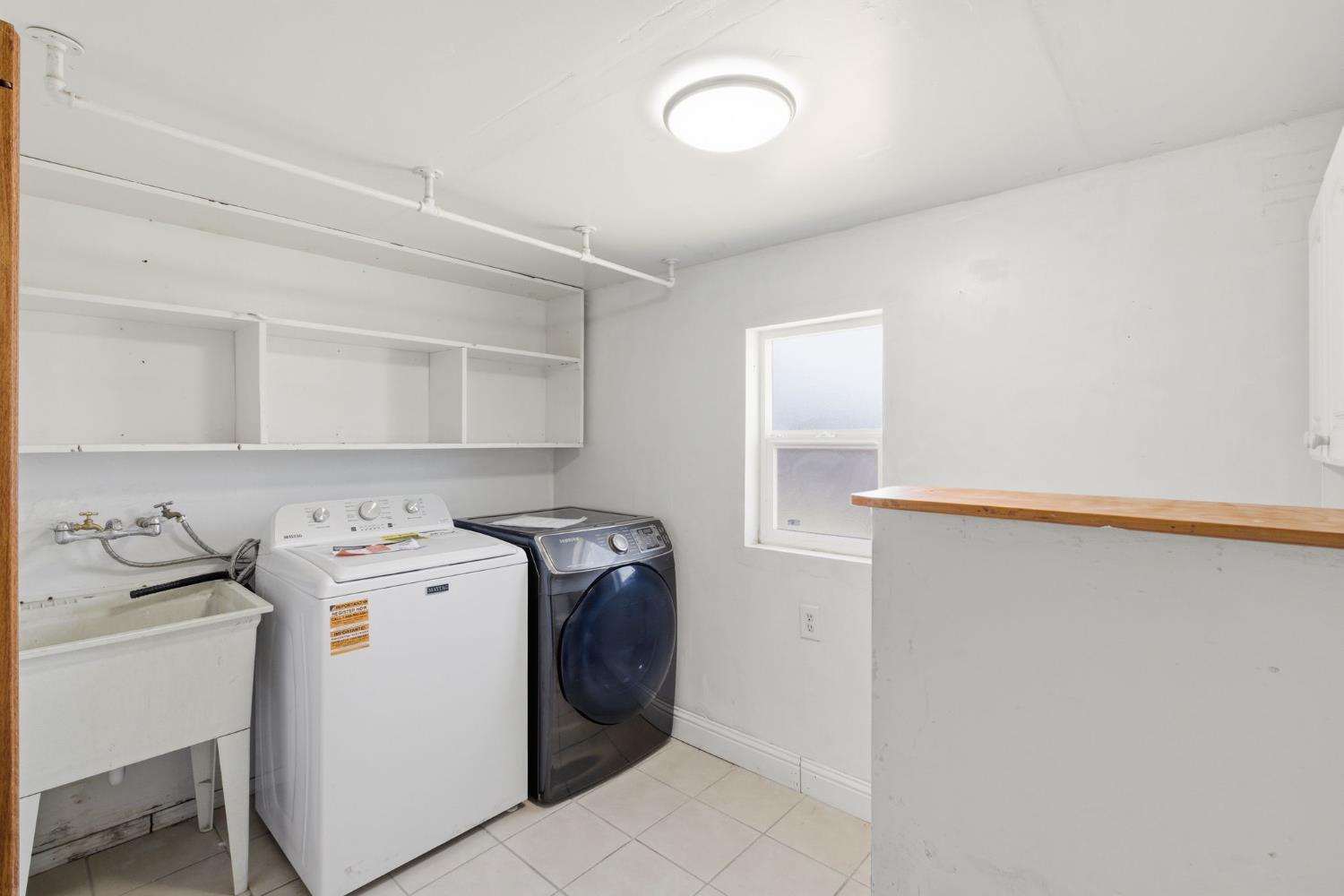 133 Oleander Avenue Lemoore, CA 93245 - Photo 24 of 30 a utility room with dryer and washer