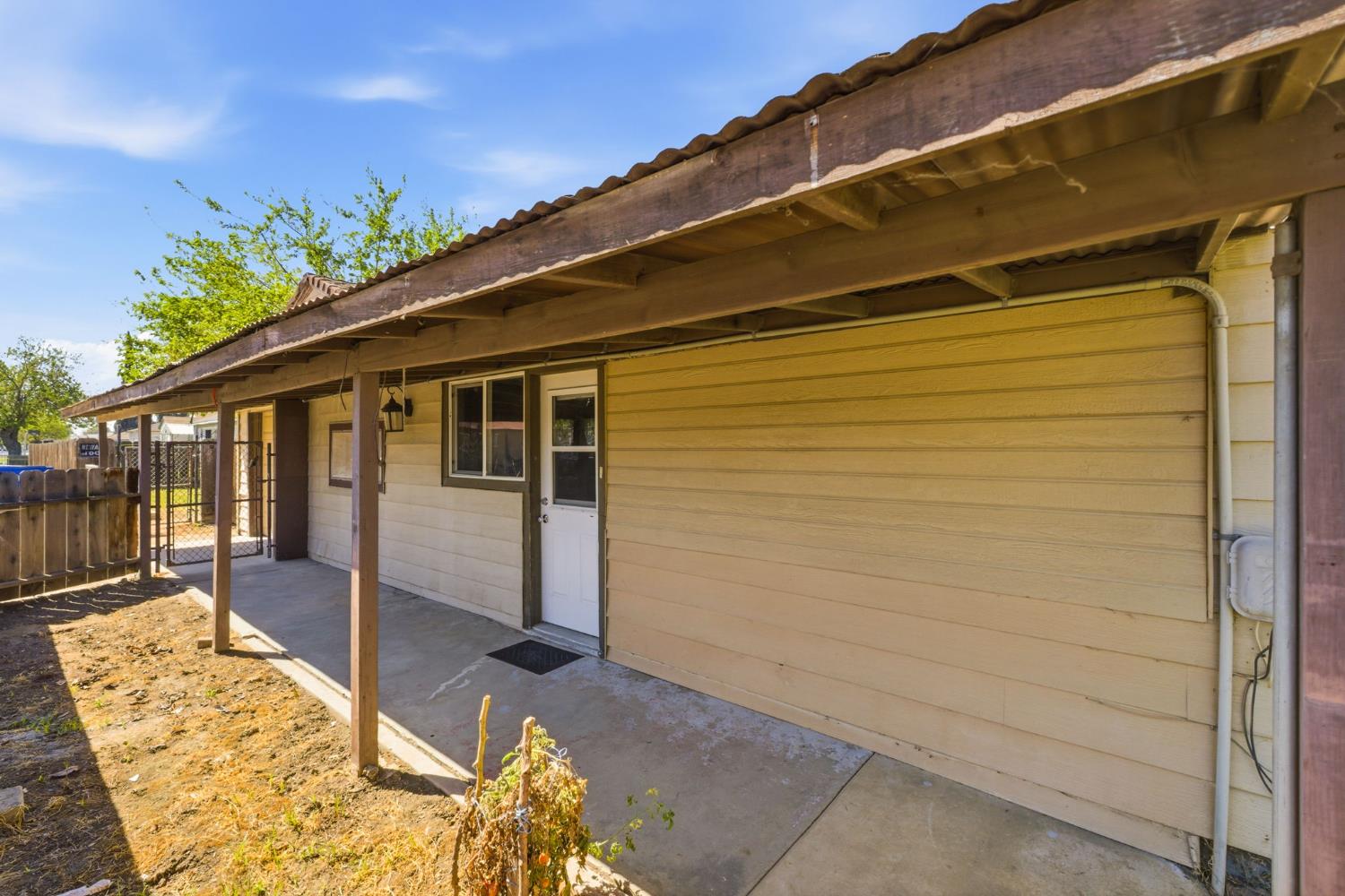 133 Oleander Avenue Lemoore, CA 93245 - Photo 6 of 30 a view of a house with a backyard