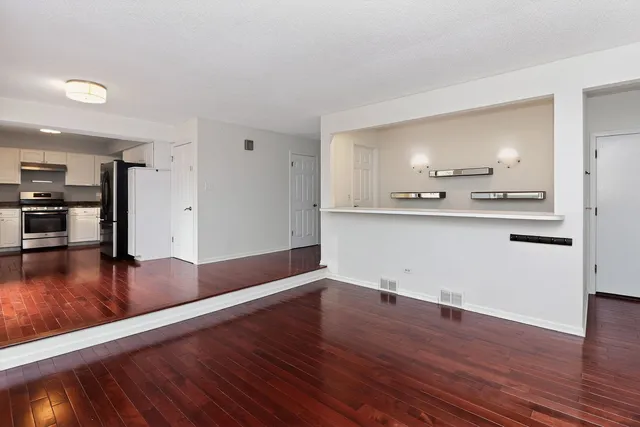 a view of a kitchen with wooden floor