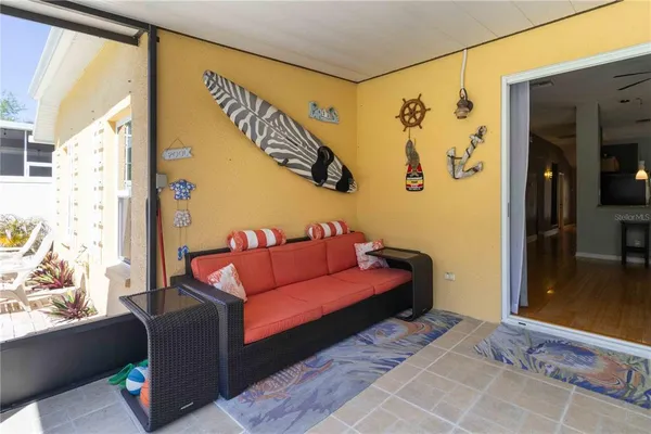 a living room with furniture and a window