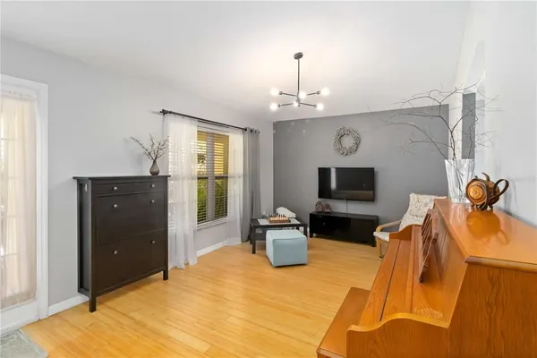 a living room with furniture flat screen tv and a fireplace