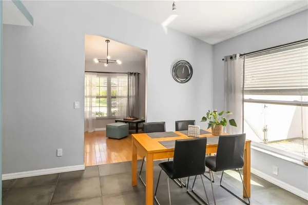 a view of a dining room with furniture and a window