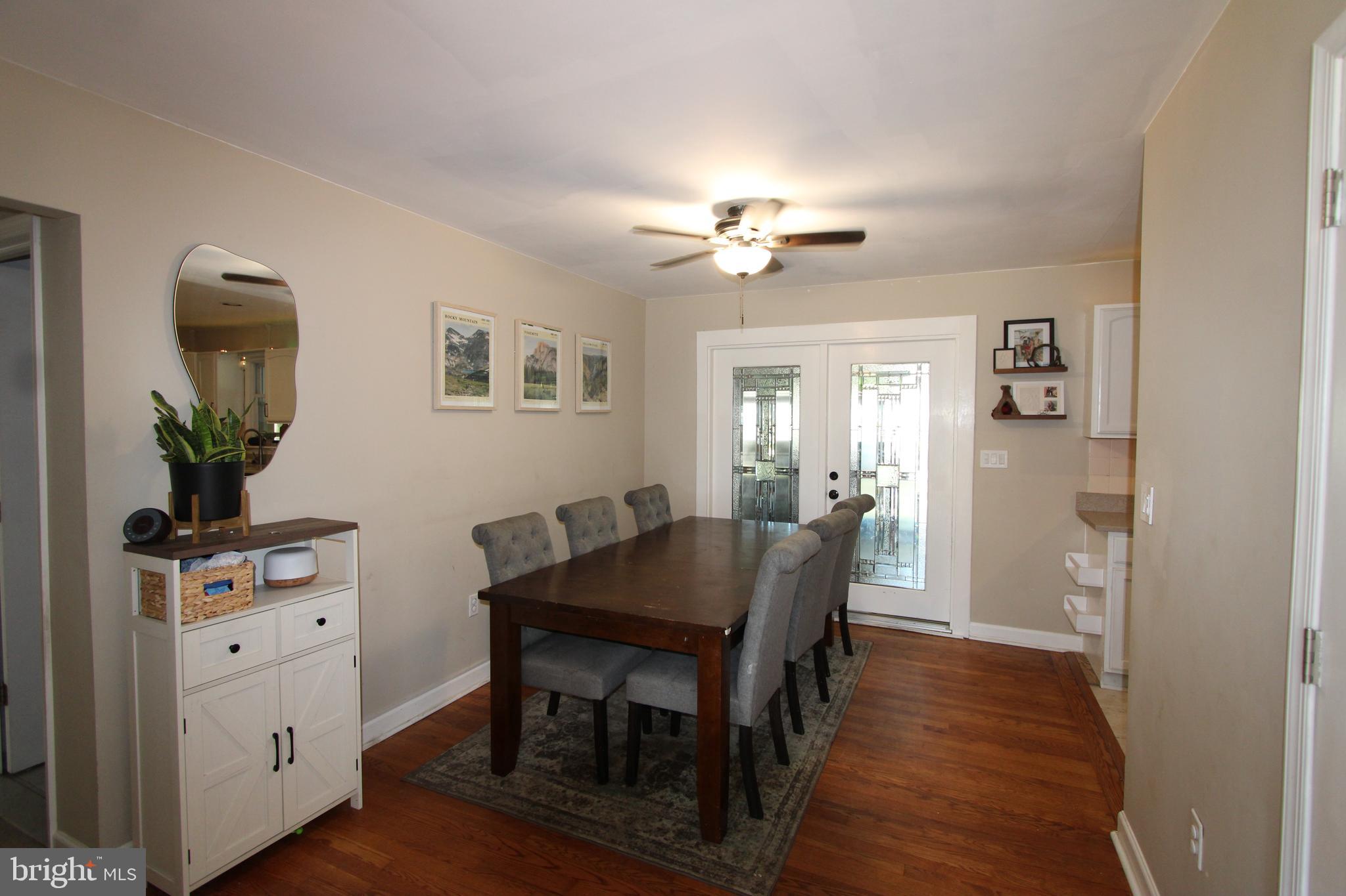 32 Nicholson Drive Pasadena, MD 21122 - Photo 21 of 21 a view of a dining room with furniture and wooden floor