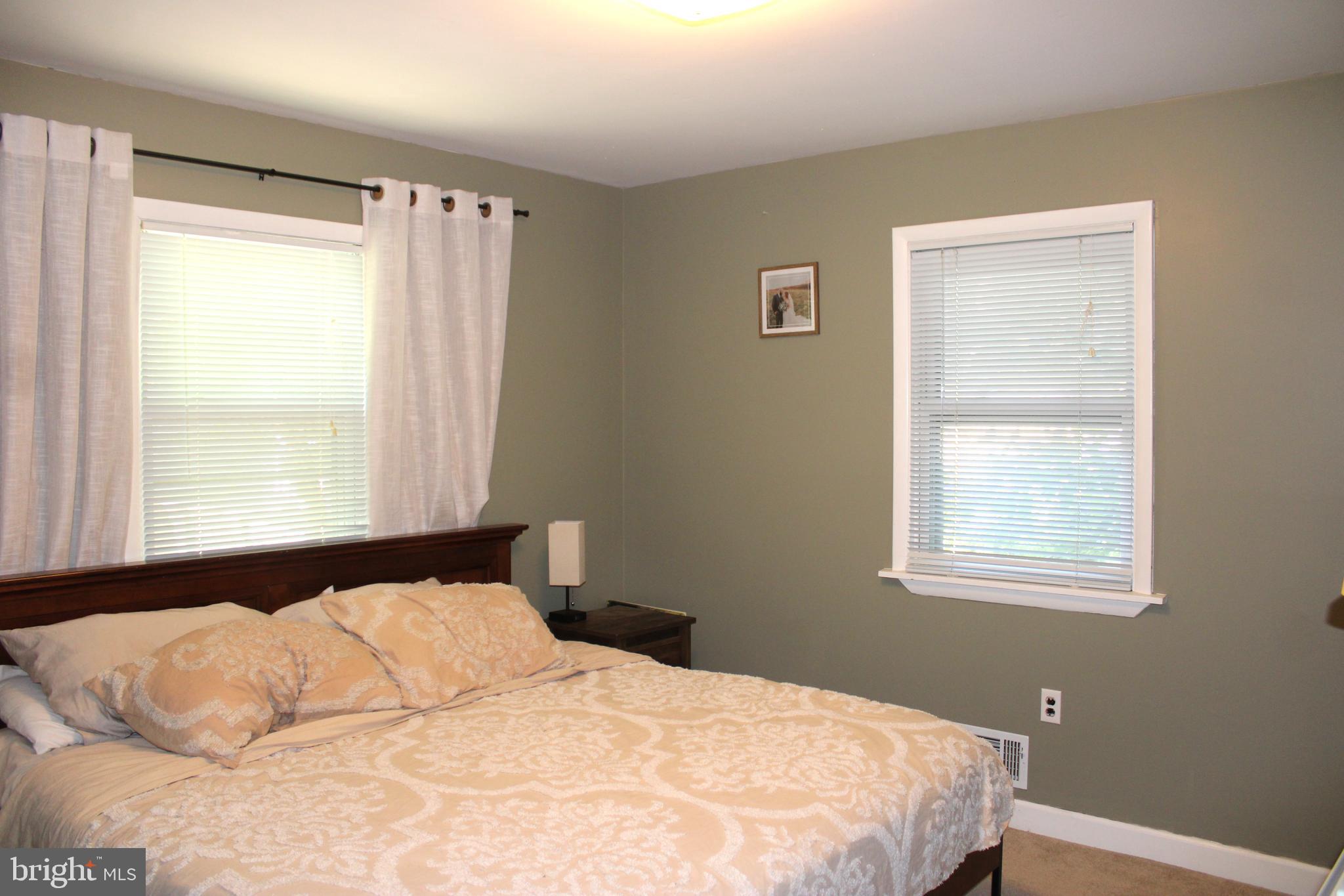 32 Nicholson Drive Pasadena, MD 21122 - Photo 8 of 21 a bedroom with a bed and a window