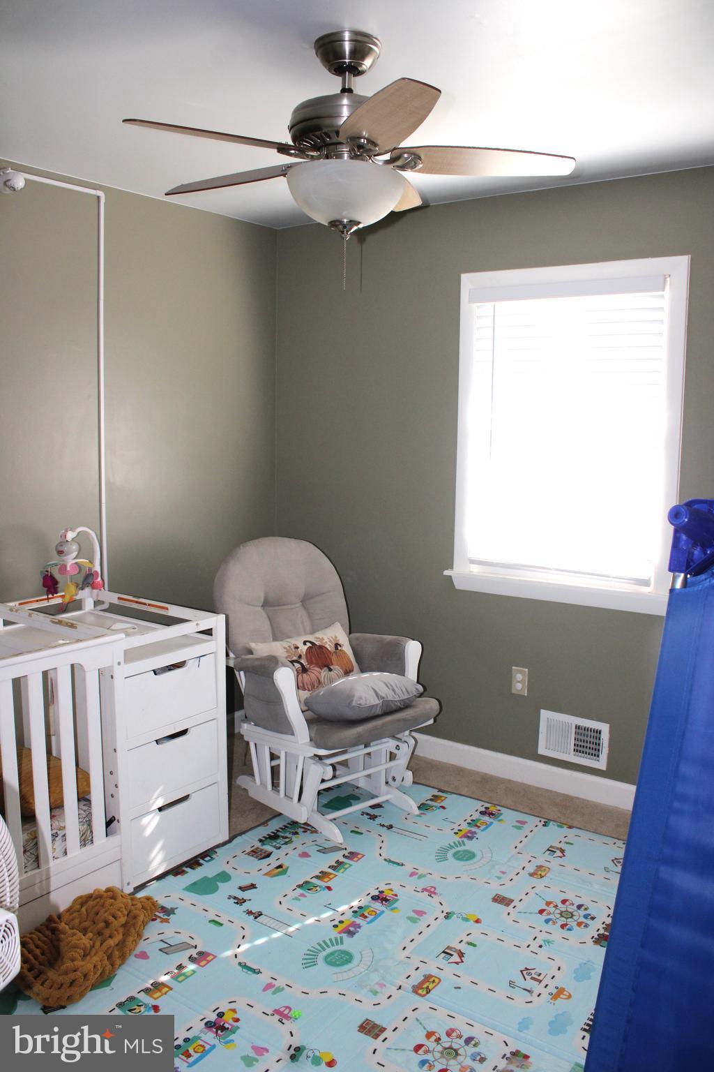 32 Nicholson Drive Pasadena, MD 21122 - Photo 9 of 21 a bedroom with a bed and a dresser in it