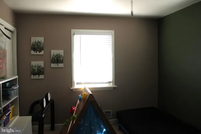 a room that has a window and furniture