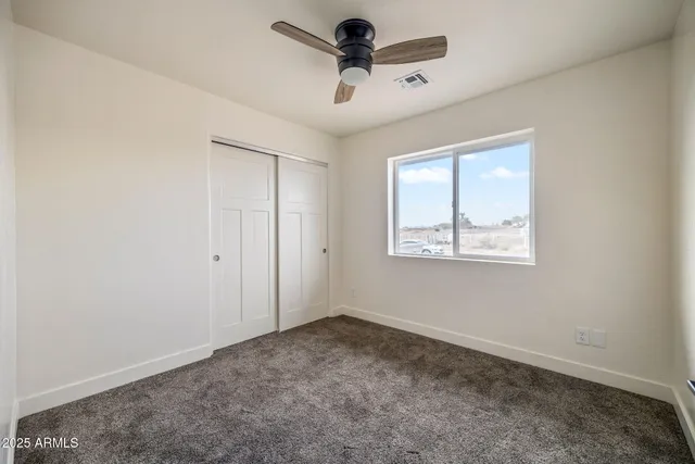 a view of room with ceiling fan
