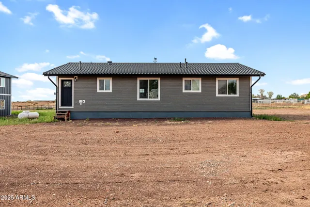 a front view of a house with yard