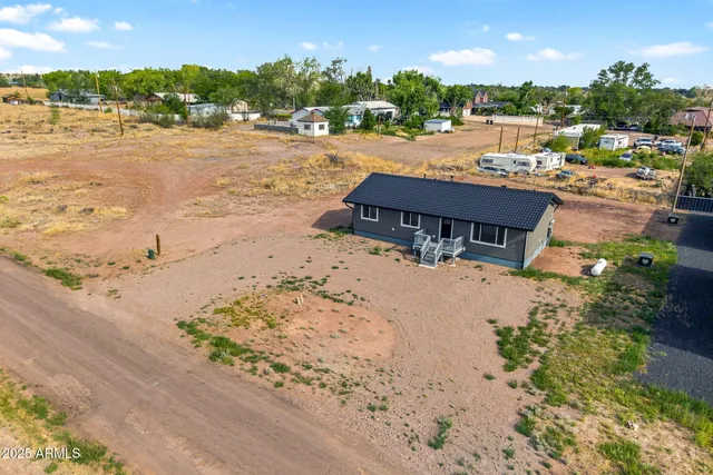 a view of a lake with beach and city view