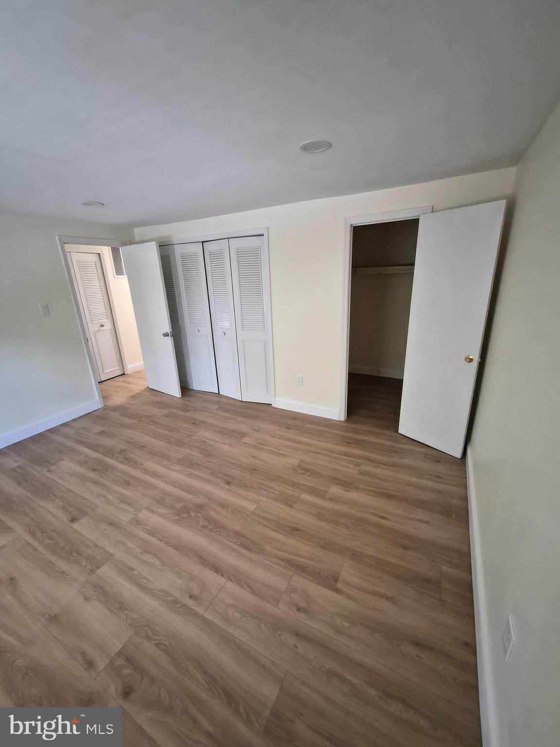 17 Rittenhouse Court Willingboro, NJ 08046 - Photo 11 of 13 a view of an empty room with wooden floor and stairs