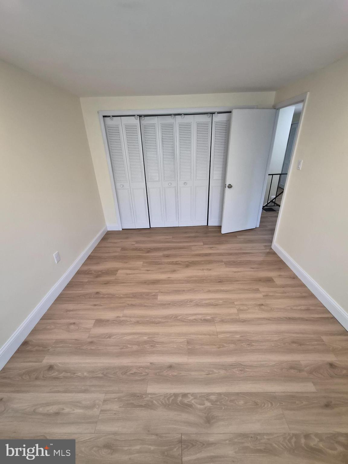 17 Rittenhouse Court Willingboro, NJ 08046 - Photo 13 of 13 a view of an empty room with wooden floor