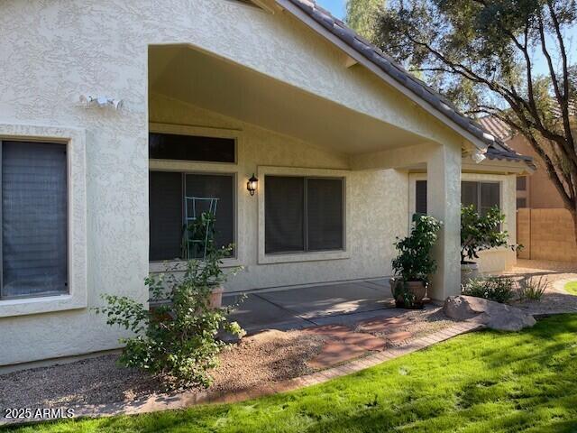 1038 South Roca Street Gilbert, AZ 85296 - Photo 11 of 47 a front view of a house with a yard