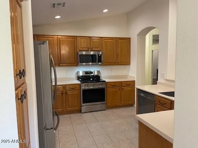 a view of a livingroom with a chandelier windows and chandelier