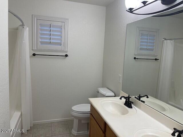 1038 South Roca Street Gilbert, AZ 85296 - Photo 44 of 47 a bathroom with a sink toilet and vanity