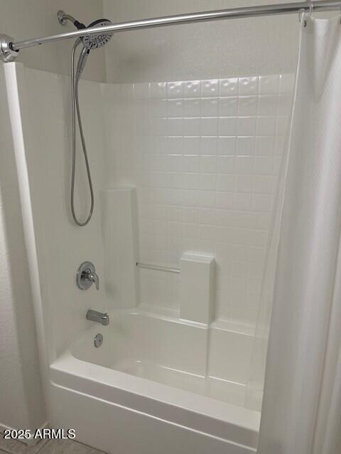 1038 South Roca Street Gilbert, AZ 85296 - Photo 45 of 47 a bathroom with a shower and a bath tub