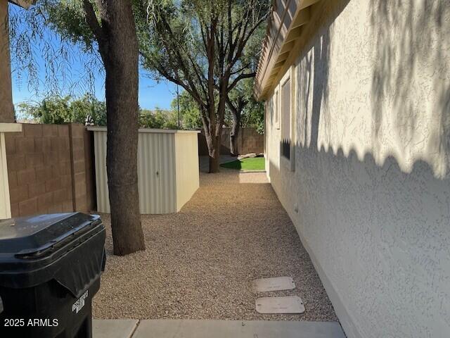 1038 South Roca Street Gilbert, AZ 85296 - Photo 9 of 47 a view of a backyard with pathway