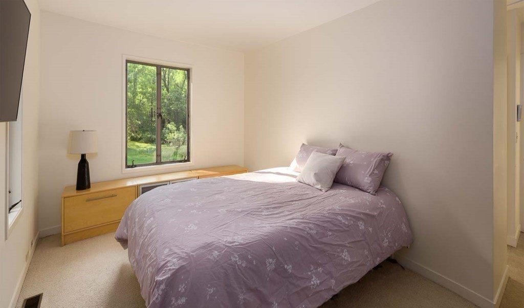 105 Trapelo Road Lincoln, MA 01773 - Photo 16 of 34 a large bed sitting in a bedroom next to a window