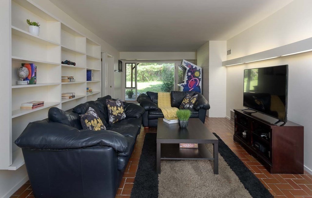 105 Trapelo Road Lincoln, MA 01773 - Photo 20 of 34 a living room with furniture and a flat screen tv