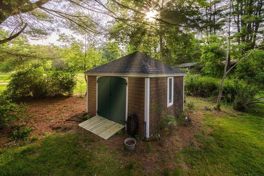 105 Trapelo Road Lincoln, MA 01773 - Photo 27 of 34 a front view of a house with a yard
