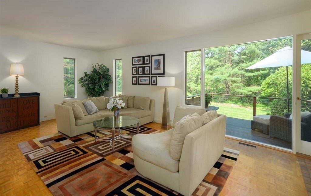 105 Trapelo Road Lincoln, MA 01773 - Photo 4 of 34 a living room with furniture and a floor to ceiling window