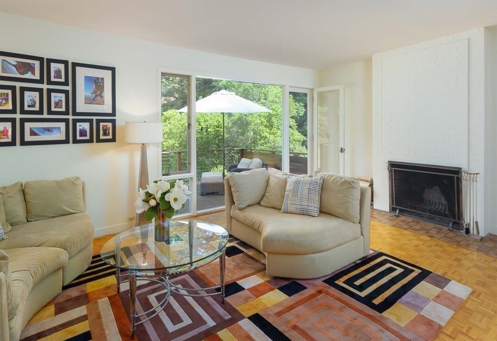 105 Trapelo Road Lincoln, MA 01773 - Photo 5 of 34 a living room with furniture and a fireplace