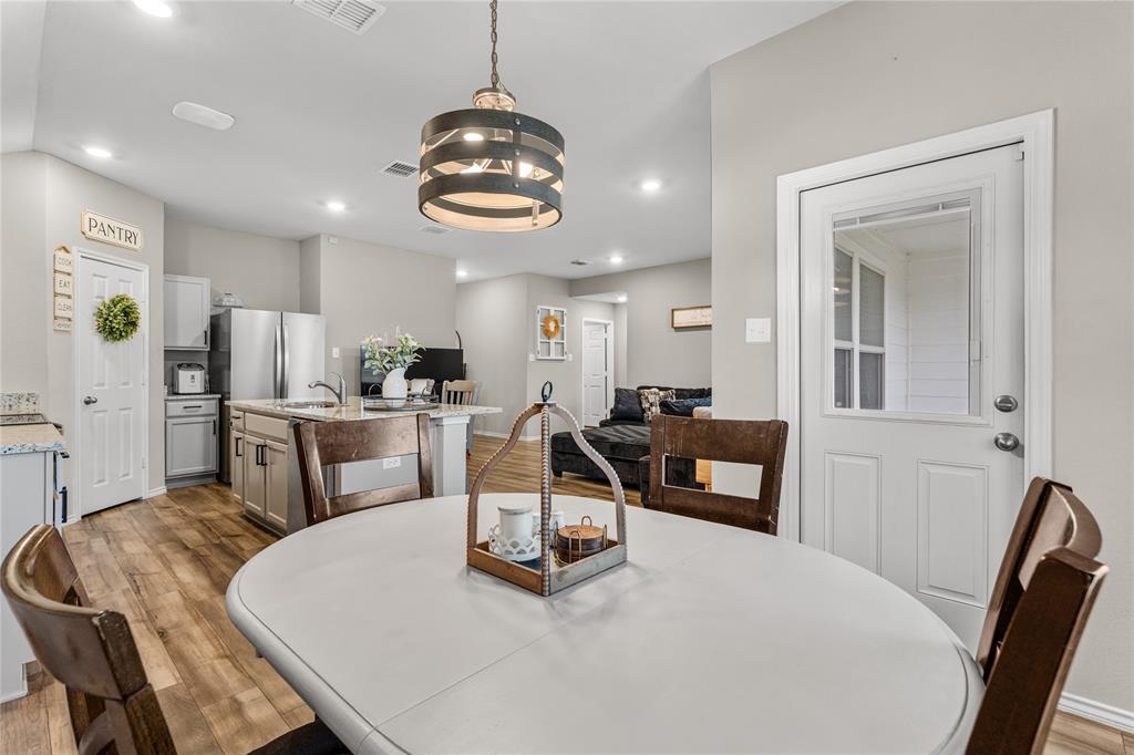 7121 Guadalupe Road Waco, TX 76633 - Photo 19 of 38 a living room with furniture and kitchen view
