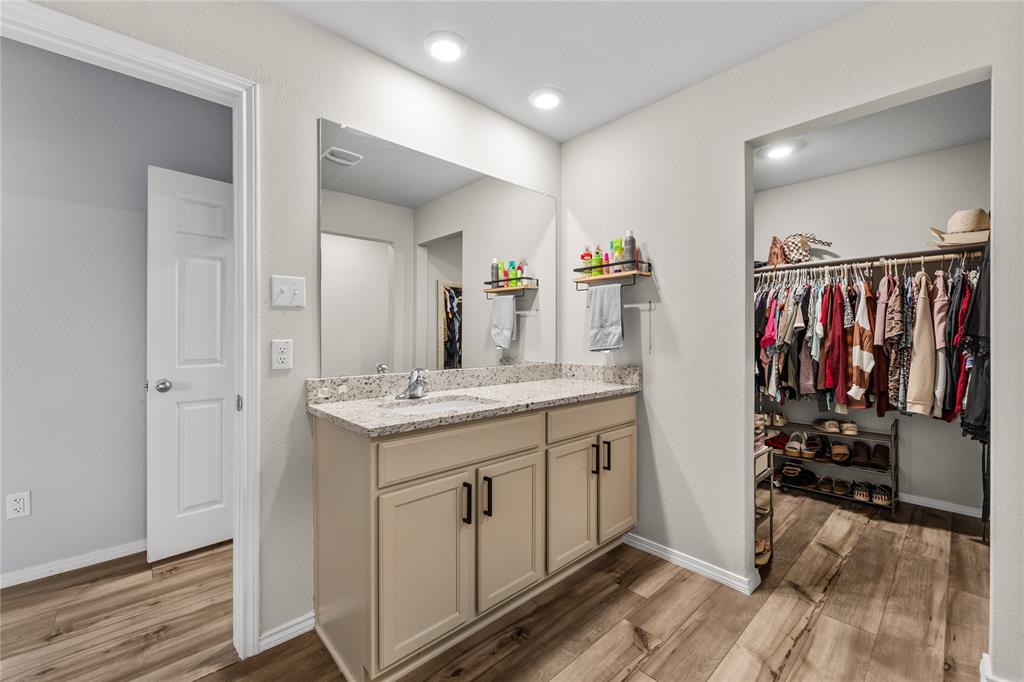 7121 Guadalupe Road Waco, TX 76633 - Photo 23 of 38 a view of a bathroom with a sink and mirror