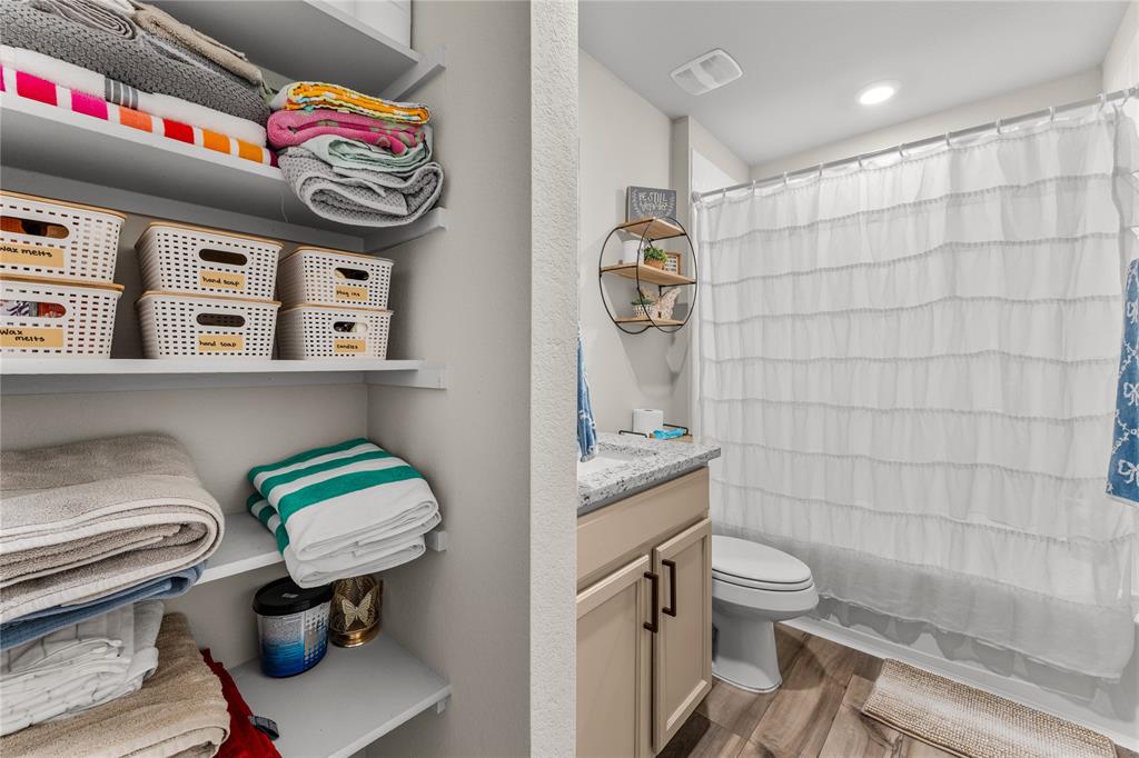 7121 Guadalupe Road Waco, TX 76633 - Photo 29 of 38 a bathroom with a toilet sink and shower