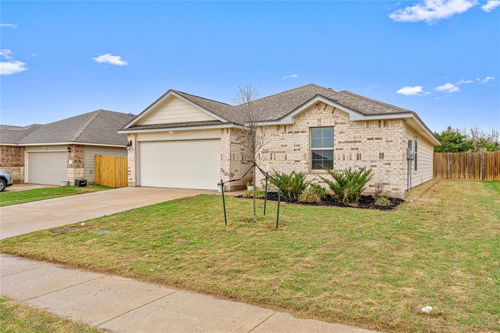 7121 Guadalupe Road Waco, TX 76633 - Photo 3 of 38 a front view of a house with garden
