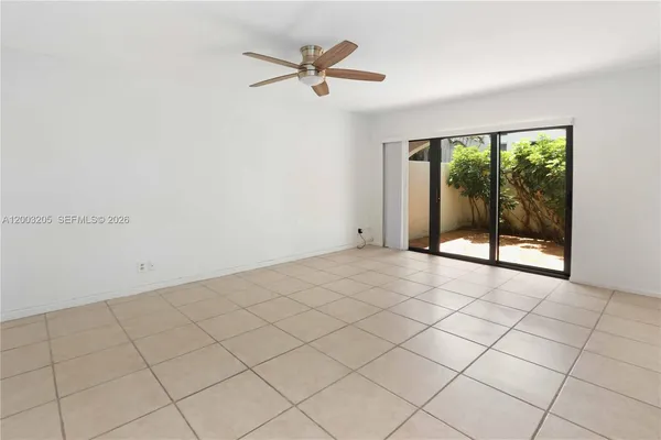 a view of an empty room and a window