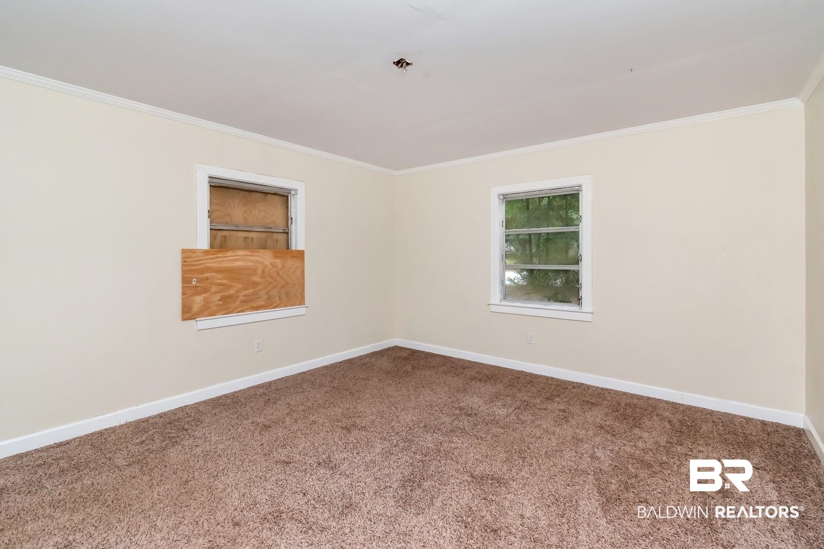 2762 Hillcrest Road Mobile, AL 36695 - Photo 14 of 25 Carpeted spare room with crown molding