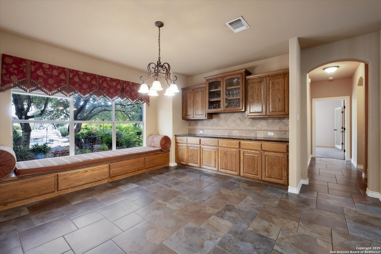 611 Ridge San Antonio, TX 78258 - Photo 12 of 42 a large kitchen with kitchen island granite countertop a sink and a stove