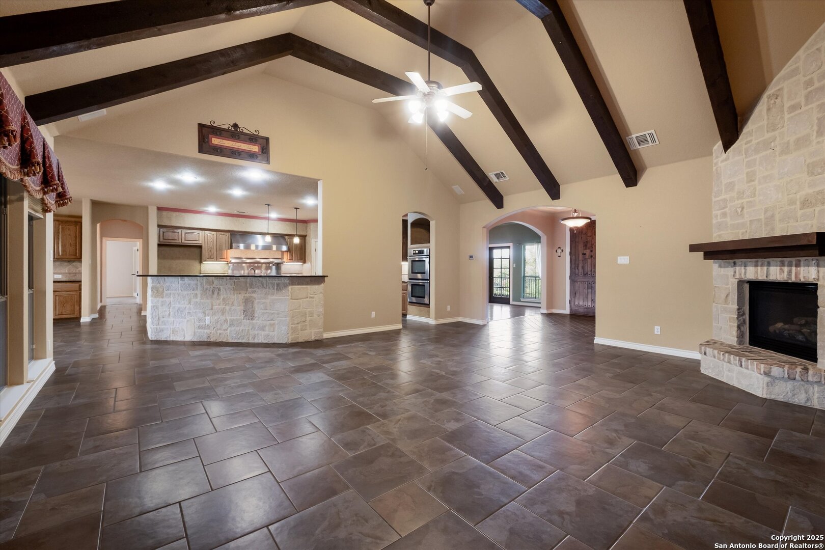 611 Ridge San Antonio, TX 78258 - Photo 15 of 42 a view of a hallway with entryway and fireplace