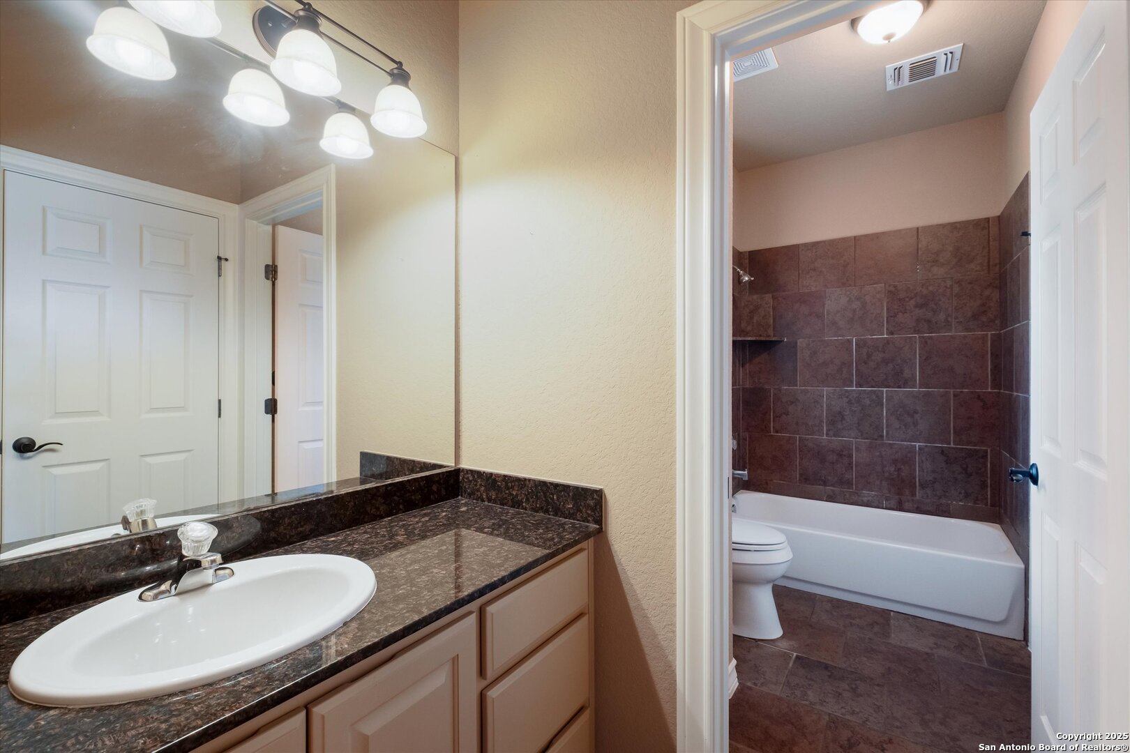 611 Ridge San Antonio, TX 78258 - Photo 17 of 42 a bathroom with a sink a toilet and shower